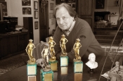 Riz Ortolani in his study with the five “David of Donatello” awards